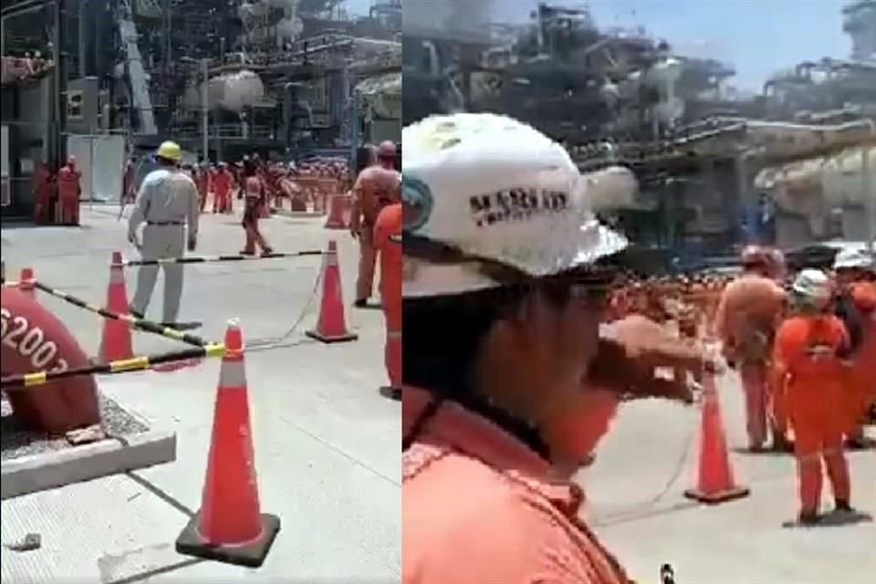 Decenas de trabajadores con overol naranja fueron evacuados.