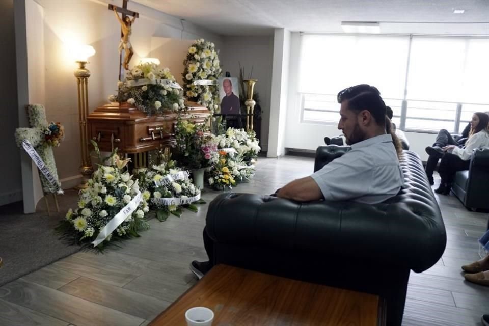 Friends and family of slain activist Adolfo Enriquez Vanderkam mourn at his funeral in Leon, Guanajuato state, Mexico, Thursday, Nov. 23, 2023.(AP Photo/Mario Armas)