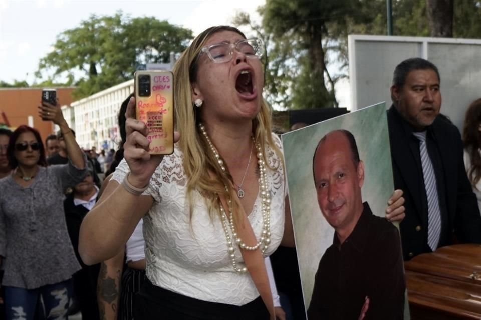 A niece of slain activist Adolfo Enriquez Vanderkam shouts asking for justice, at his funeral in Leon, Guanajuato state, Mexico, Thursday, Nov. 23, 2023. (AP Photo/Mario Armas)