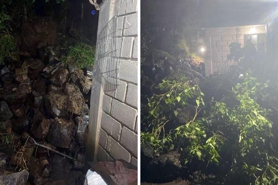 Vecinos reportaron que a causa del derrumbe de una barda, una familia quedó atrapada al interior de una casa.