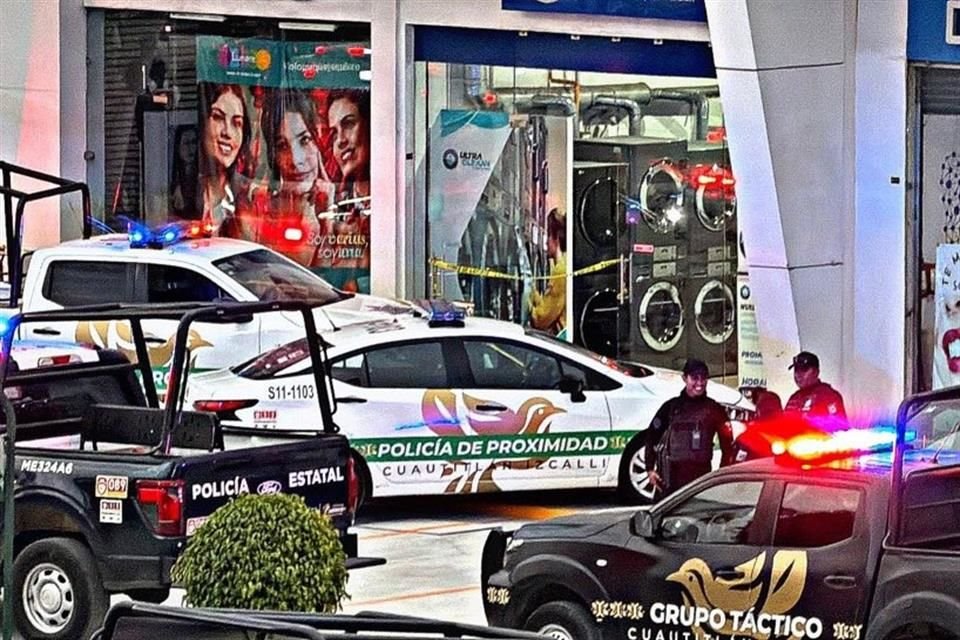 Elementos de seguridad de Cuautitlán Izcalli y Guardia Nacional acudieron al local de lavandería donde fueron asesinadas las dos personas. Se espera el arribo de la Fiscalía mexiquense.